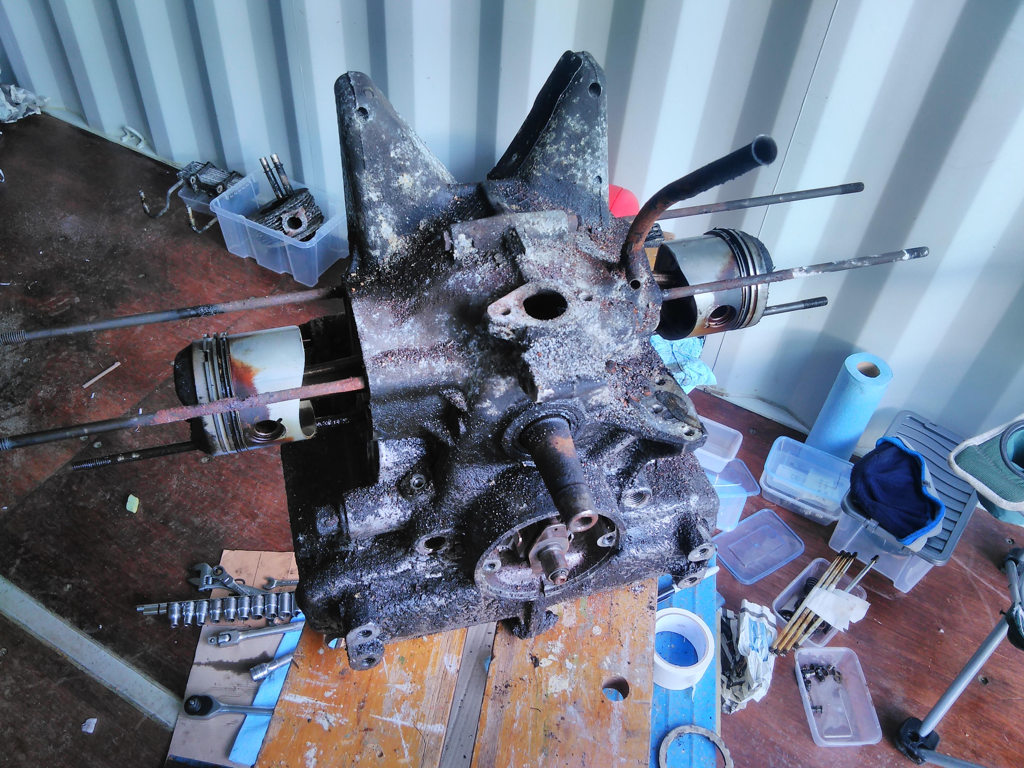 2CV engine with cylinders and heads removed showing pistons