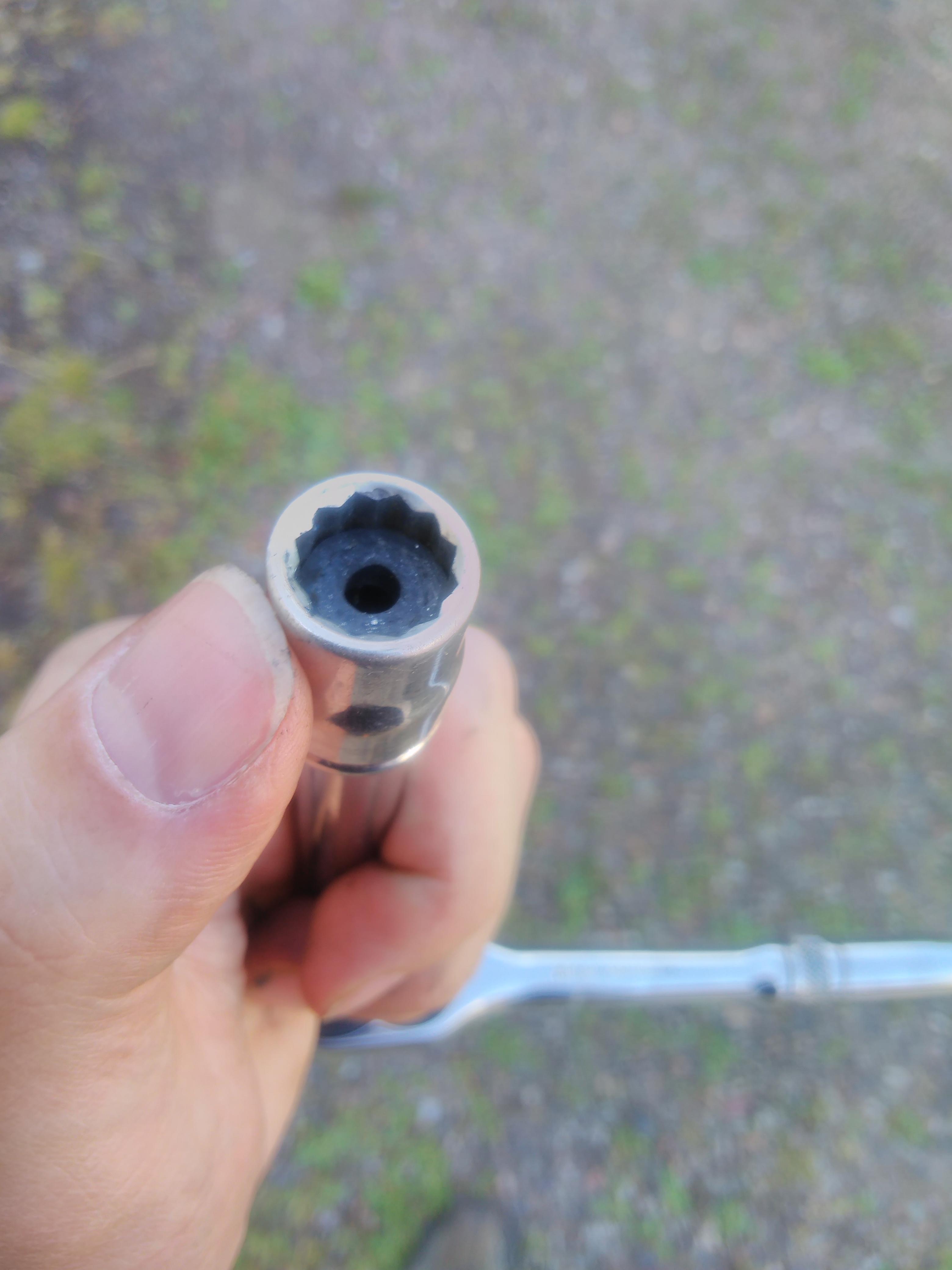 11mm socket with fuel hose in it