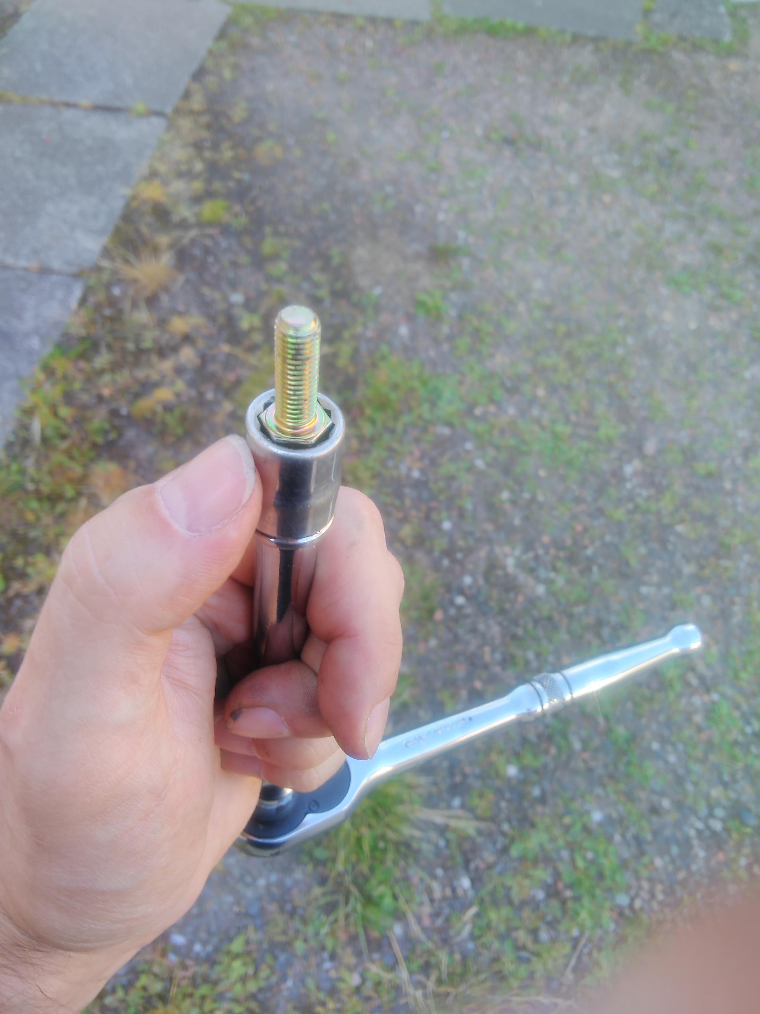 11m socket with fuel hose in it holding up a bolt